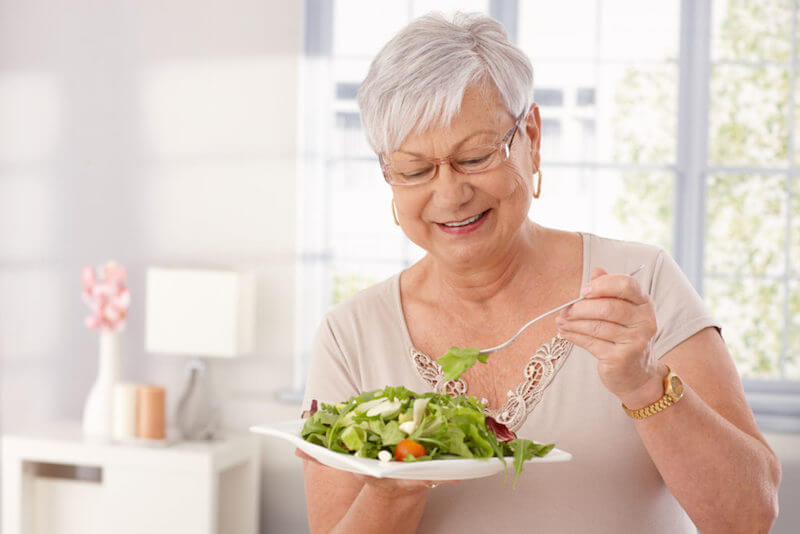 dental implants patient eating salad