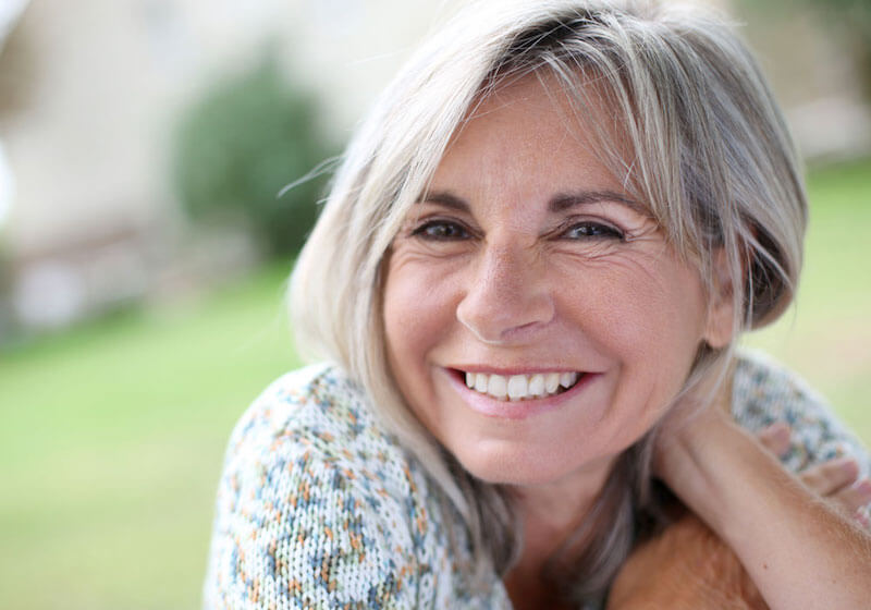 dental implants patient smiling after procedure