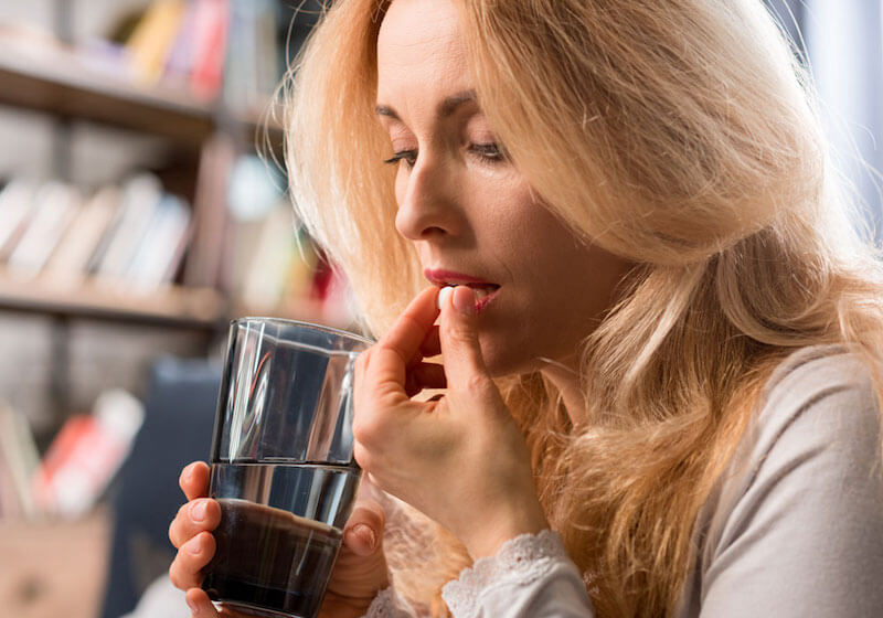 dental patient taking oral sedation pill