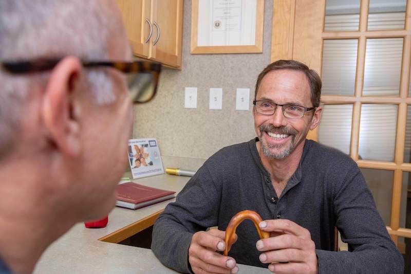 implant patient talking with dr wilhelm