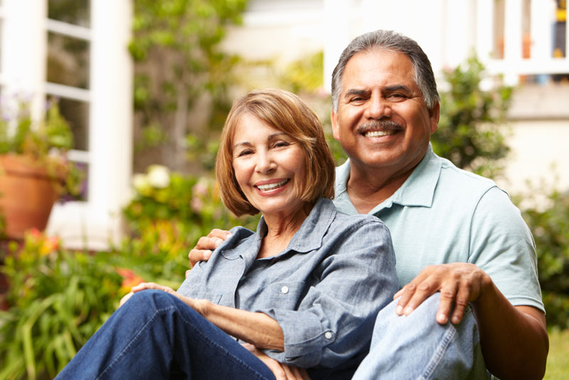 Dental Implant Patients Smiling Together After Their Dental Implant Procedure