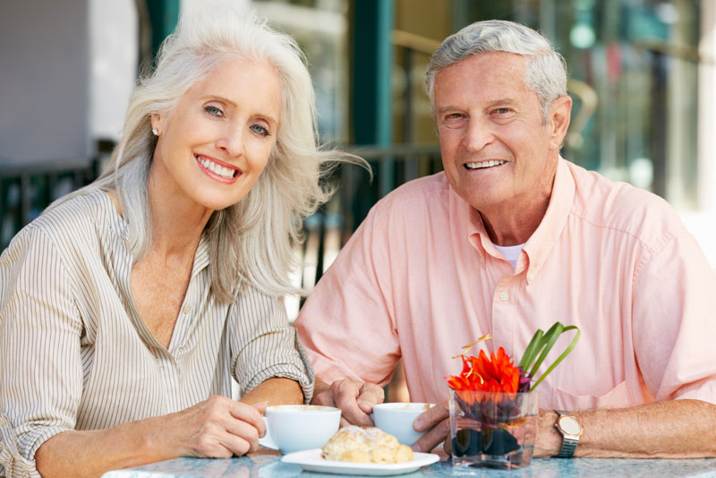 Dental Implant Patients Eating Together With Their False Teeth in Woodbury, MN