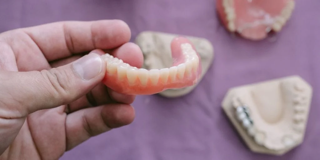 Types of Dental Implants vs. Types of Dentures: Key Differences