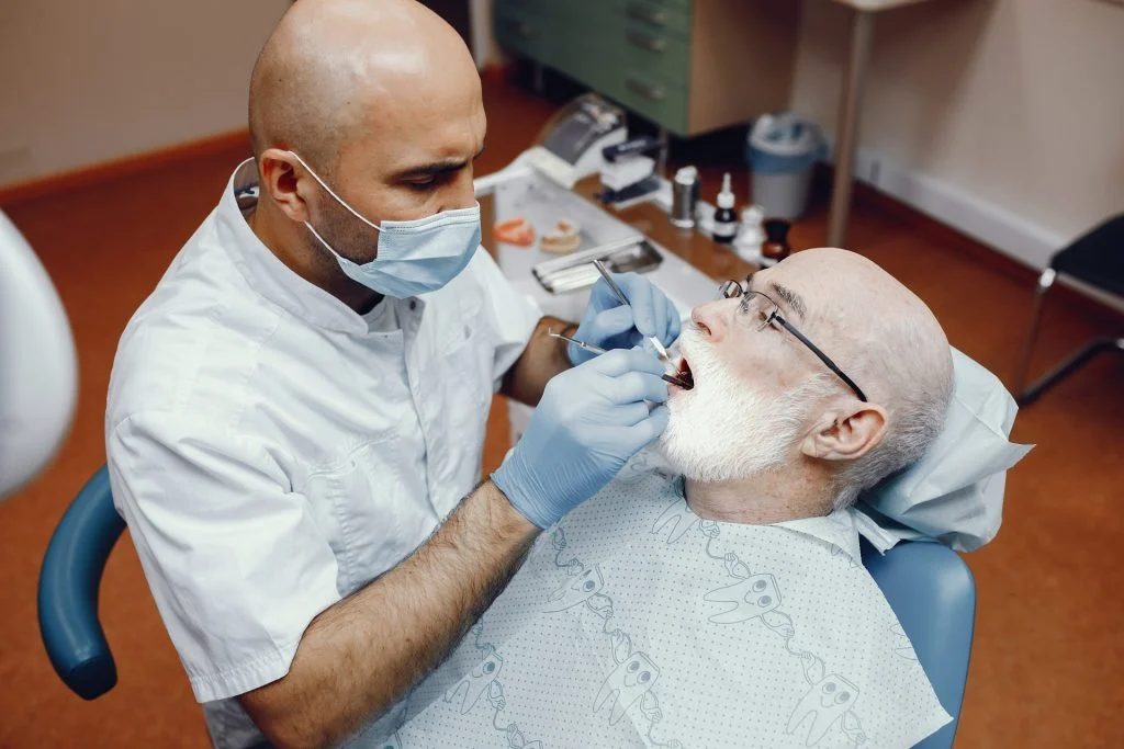 old man sitting dentist s office 1