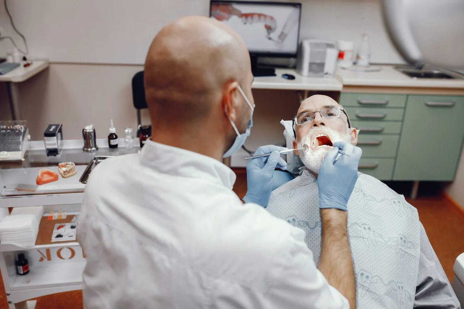 old man sitting dentist s office 4